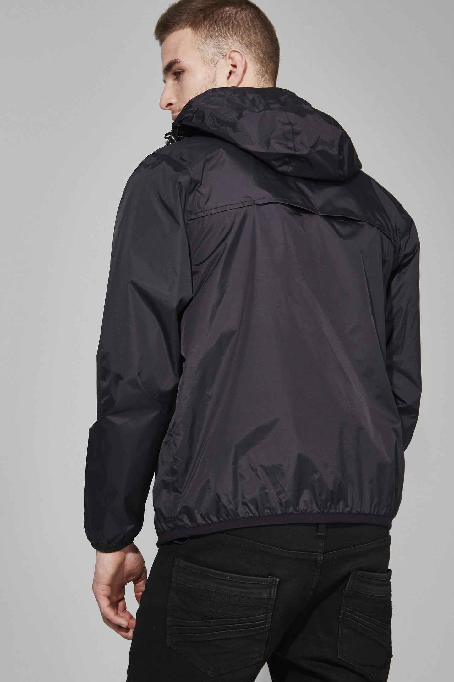 Quarter zip packable light rain jacket and windbreaker in black